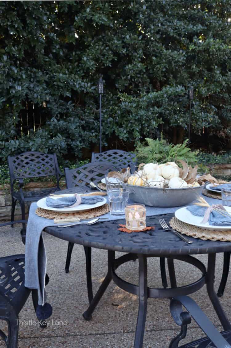 Patio table with fall accents. Charming Rustic Fall Al Fresco Tablescape Ideas.