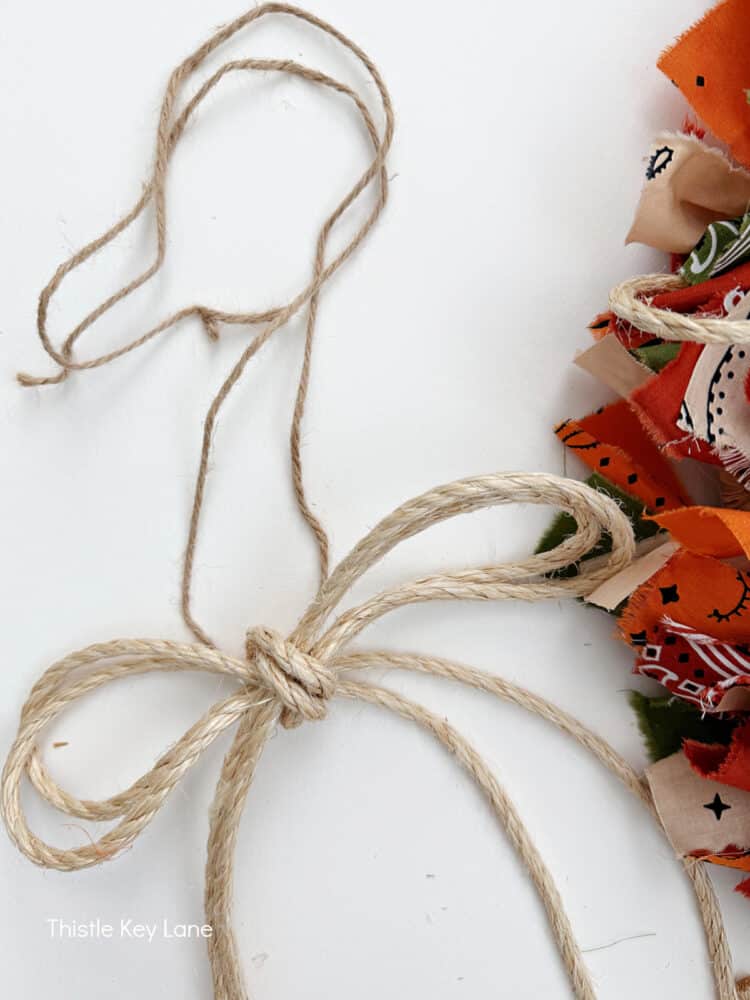 Add a rope bow to wreath. Create A Fall Rope And Bandana Wreath.
